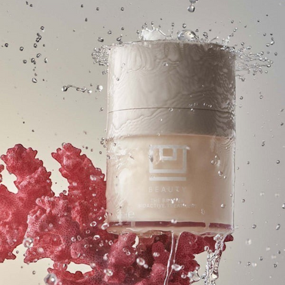 Shop Rescue Spa The Barrier Bioactive Treatment cream jar surrounded by water splashes and a coral-like structure.