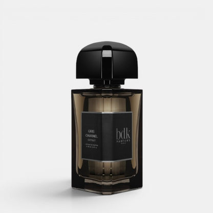 Front-facing product photo of BDK Parfums Gris Charnel Extrait on a clean white background, showcasing the perfume bottle’s dark, minimalist glass design.