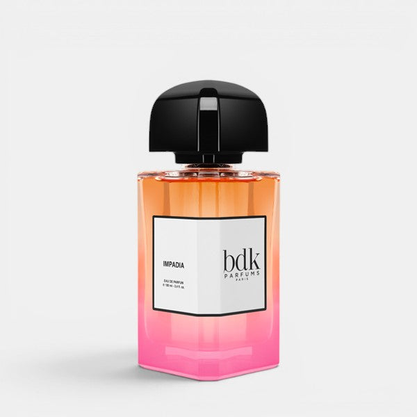 BDK Parfums Impadia perfume bottle centered front view white background orange to pink gradient fragrance juice black cap luxury niche fragrance