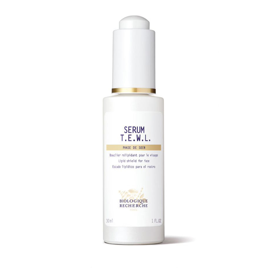 Biologique Recherche Sérum T.E.W.L. 1.0 fl.oz – A white skincare bottle with a branded white label featuring dark blue lettering and gold accents, displayed upright on a white background. This intensive hydrating and barrier-repair serum is designed to prevent trans-epidermal water loss and deeply nourish dehydrated skin.