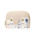 Set of Biologique Recherche Travel Essentials skincare products in a beige travel bag on a white background