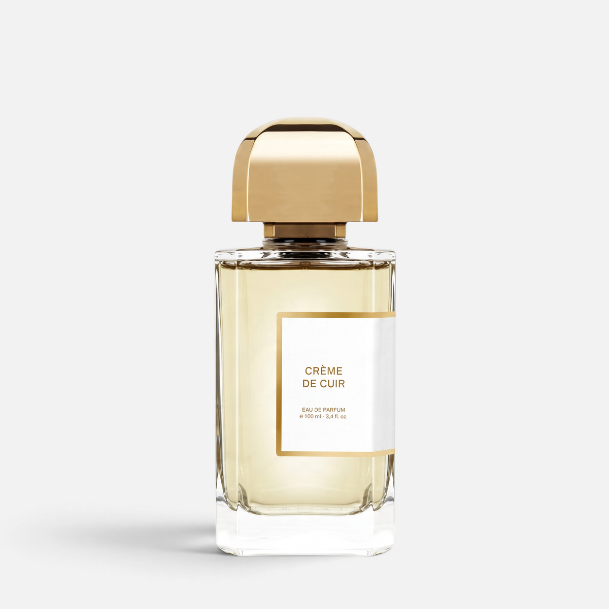 Shop Rescue Spa Creme De Cuir eau de parfum in a clear glass bottle with a gold cap and white label