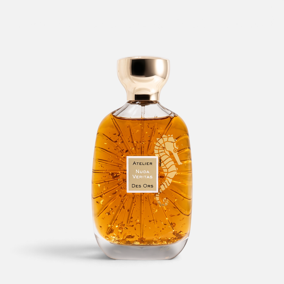 Shop Rescue Spa Atelier Nuda Veritas perfume bottle with gold flakes and seahorse emblem on a white background