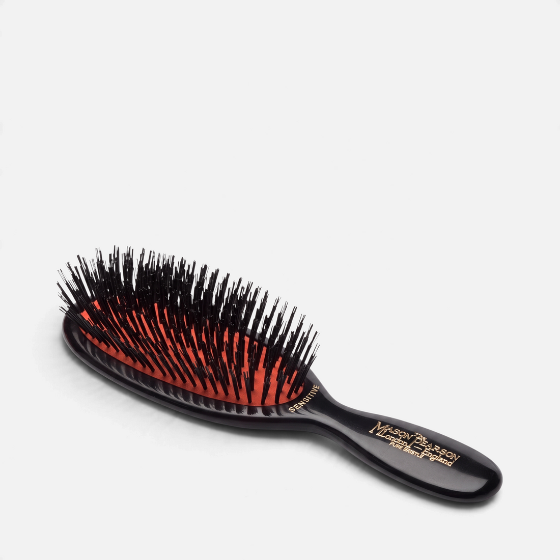 Shop Rescue Spa Pocket Sensitive pure boar bristle hairbrush with a black cellulose acetate handle and orange cushion