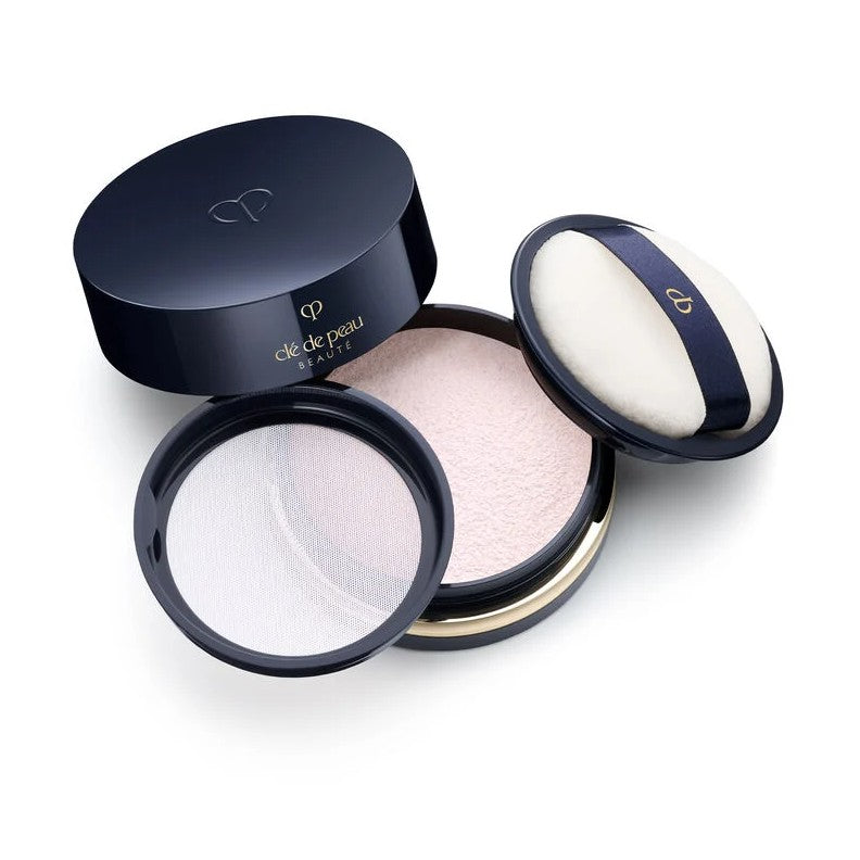 Cle De Peau Beaute Translucent Loose Powder, position centered and open with a white background. Sets and perfects skin for a flawless, luminous finish.