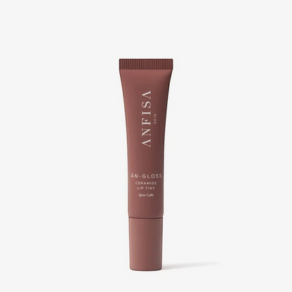 Shop Rescue Spa AN-GLOSS ceramide lip tint in Spice Cake, a muted pinkish-brown squeeze tube for glossy lip care.