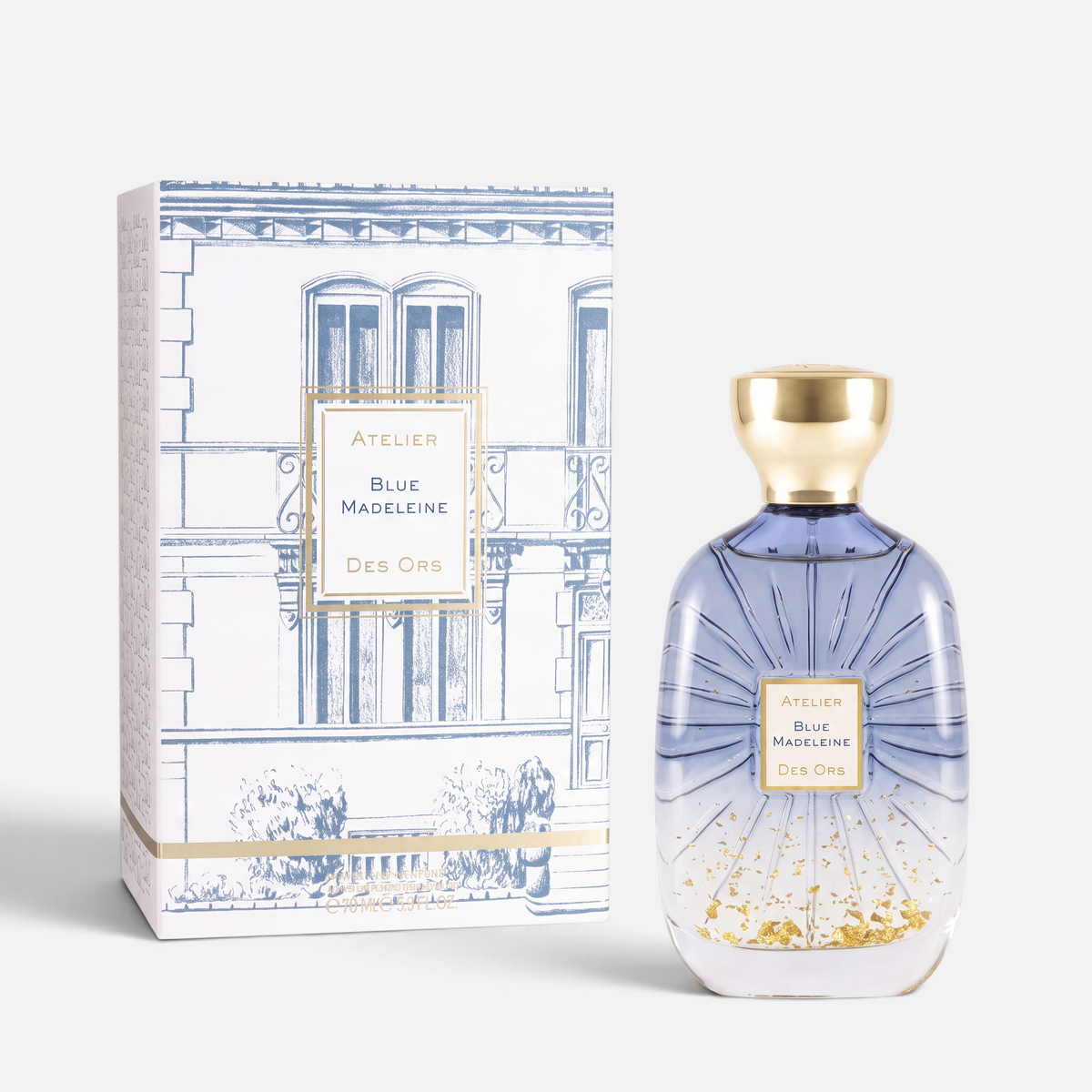 Shop Rescue Spa Blue Madeleine perfume bottle with gold flakes and matching illustrated box on a white background