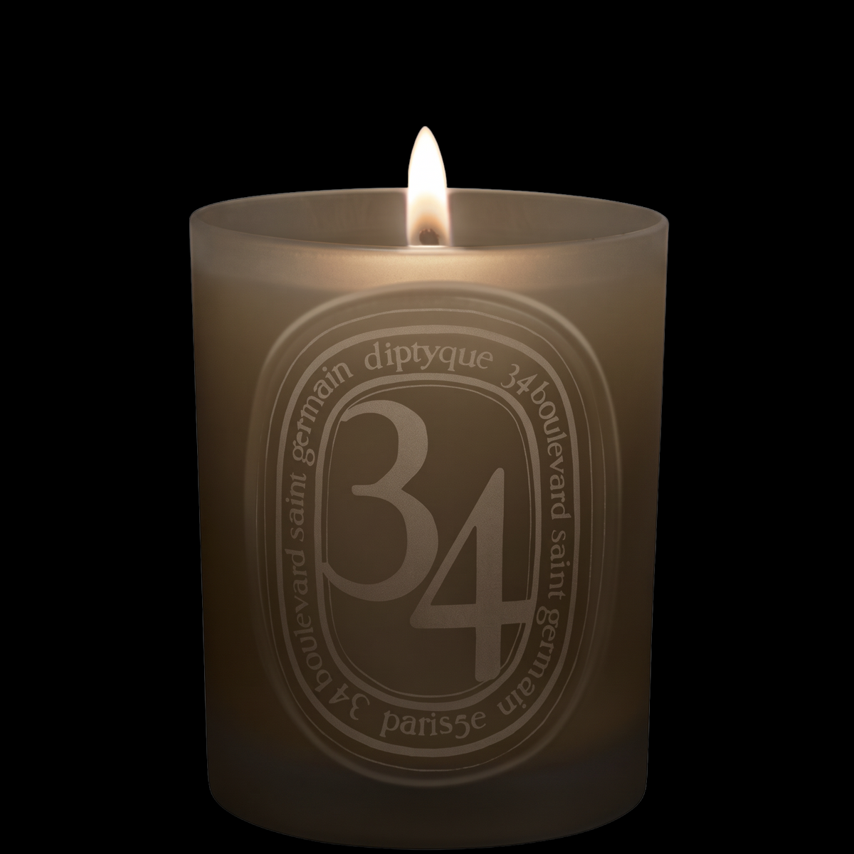Shop Rescue Spa Diptyque 34 Boulevard Saint Germain scented candle in a signature grey glass vessel with lit wick