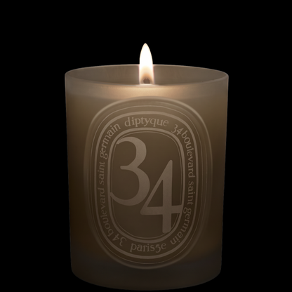 Shop Rescue Spa Diptyque 34 Boulevard Saint Germain scented candle in a signature grey glass vessel with lit wick