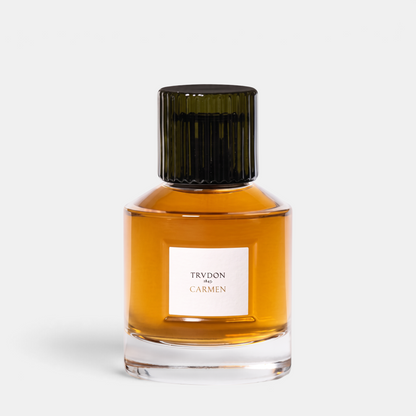 Shop Rescue Spa Trudon Carmen Eau de Parfum in a clear glass bottle with a dark ribbed cap and amber fragrance liquid.