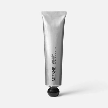 Shop Rescue Spa Mienne Hand Creme in Incendier scent, a 60ml silver metal tube with a black cap.