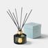Shop Rescue Spa Le Grand Diffuser Ernesto with dark green fluted glass bottle, gold emblem, and black reed sticks.