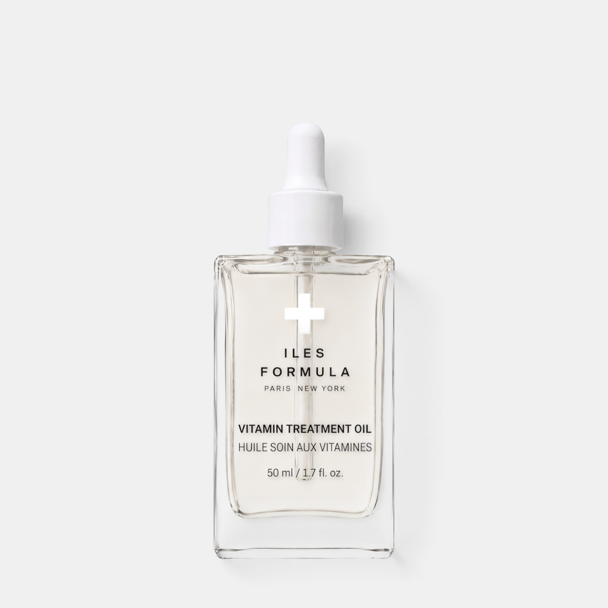 Shop Rescue Spa Iles Formula Vitamin Treatment Oil in a clear glass dropper bottle with white cap