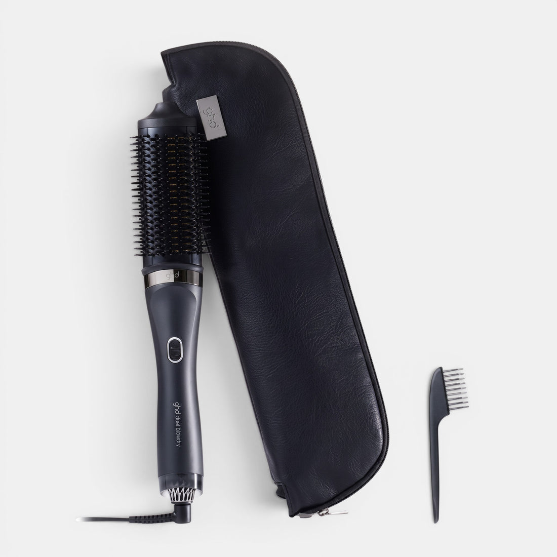 ghd Duet Blowdry hair dryer brush with black storage case and cleaning tool for salon-quality volume.