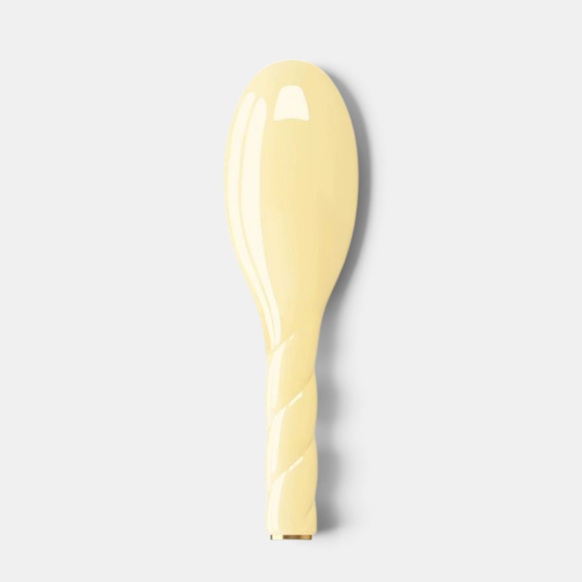Shop Rescue Spa N.02 Essential Petite Hair Brush in pale yellow with a twisted handle design