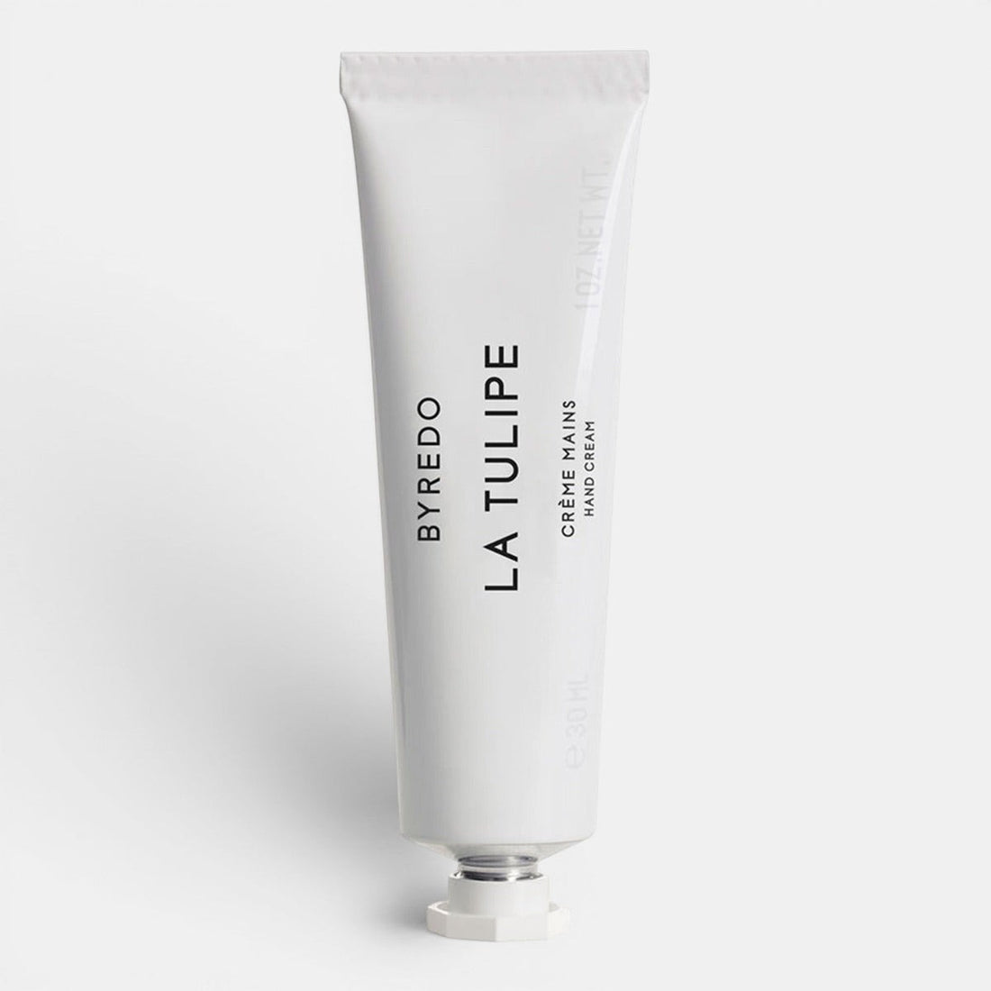 White hand cream tube of Byredo La Tulipe text on a white background