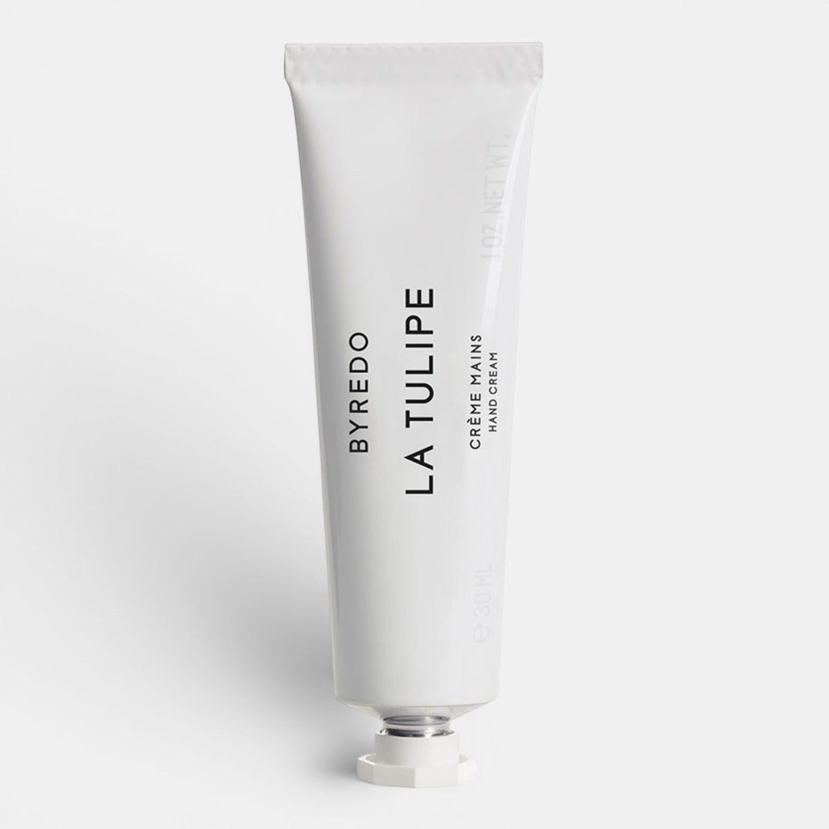 White hand cream tube of Byredo La Tulipe text on a white background