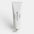 White hand cream tube of Byredo La Tulipe text on a white background