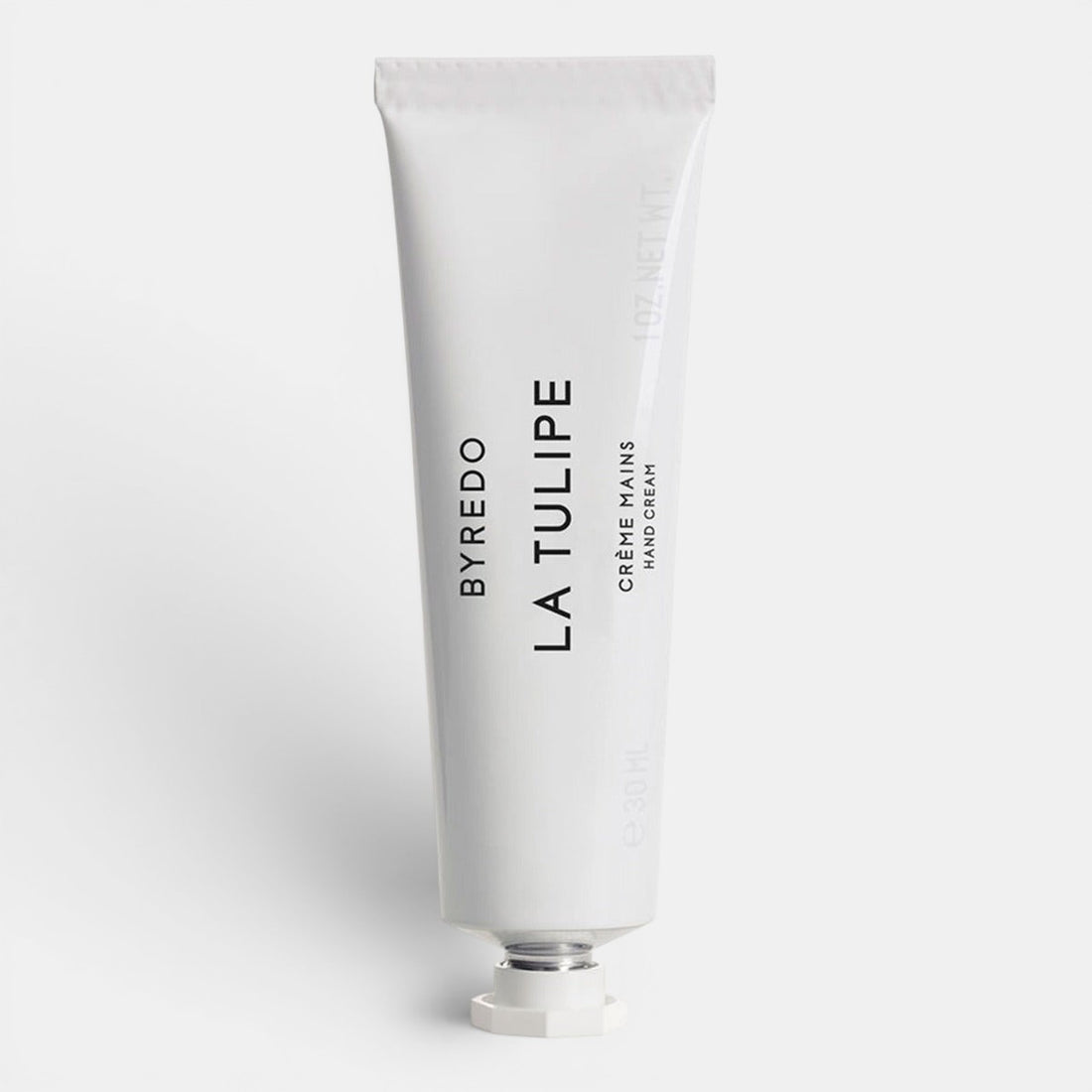 White hand cream tube of Byredo La Tulipe text on a white background