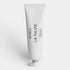 White hand cream tube of Byredo La Tulipe text on a white background