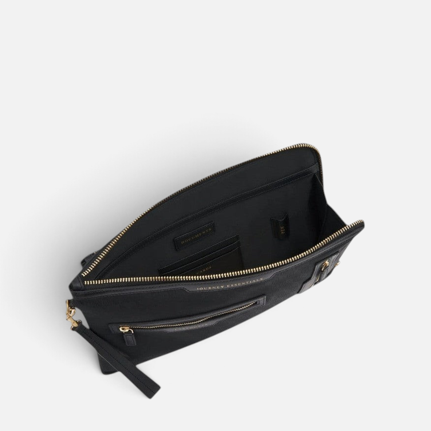 Shop Rescue Spa black nylon Journey Essentials pochette with gold zip, wrist strap, and labelled internal pockets.