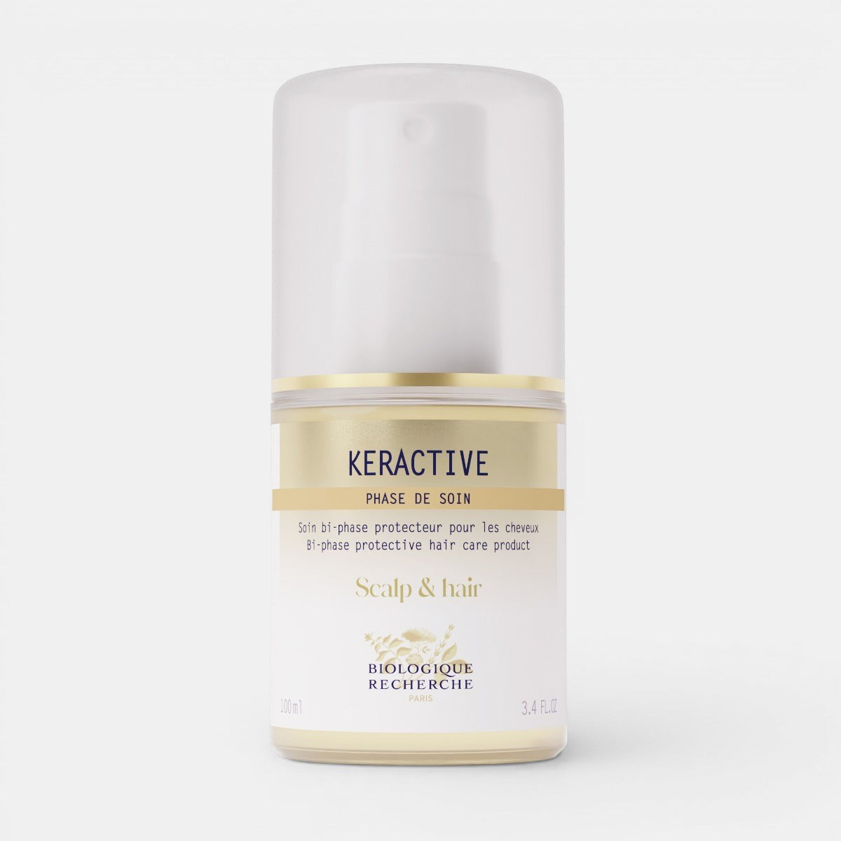 Keractive scalp and hair care product in a clear spray bottle with silver cap, displayed on a white background. The elegant packaging highlights its professional, salon-quality formula designed for hair protection and moisture.