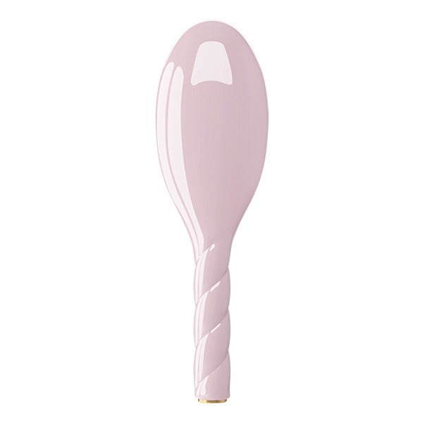 Pink ceramic spoon on a white background