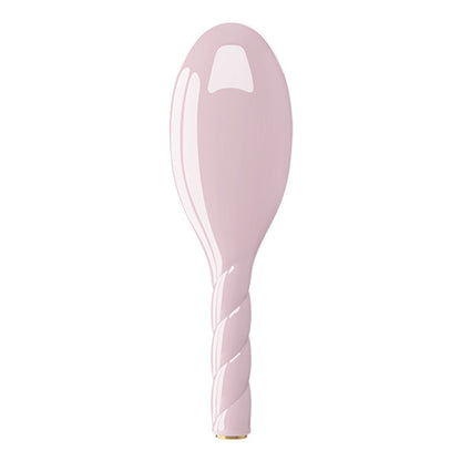 Pink ceramic spoon on a white background