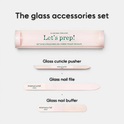Manucurist “Let’s prep!” glass accessories set shown with case and three tools: glass nail file, glass cuticle pusher, and glass nail buffer arranged on a light background.