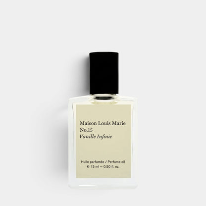 A 15 ml bottle of Maison Louis Marie No.15 Vanille Infinie perfume oil, featuring a clear glass bottle with a black cap and a beige label, set against a light gray background.