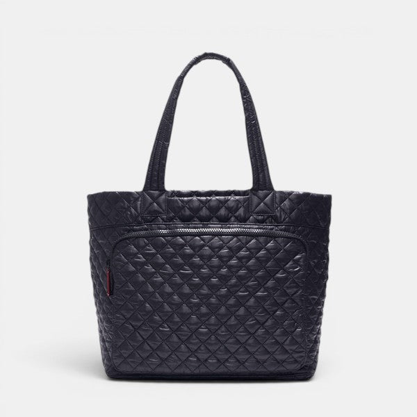 Black quilted handbag on a light gray background