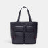 Black quilted tote bag with red accents on a white background