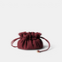Shop Rescue Spa Lotus Petit jewelry pouch in deep burgundy neoprene with a drawstring closure and gold hardware.