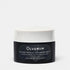 Jar of Olverum Alpine Revive Cleansing Balm on a grey background