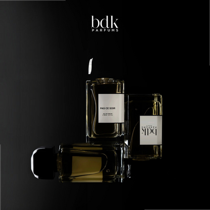Shop Rescue Spa BDK Parfums Pas Ce Soir 100ml perfume bottles arranged on a dark, moody background.