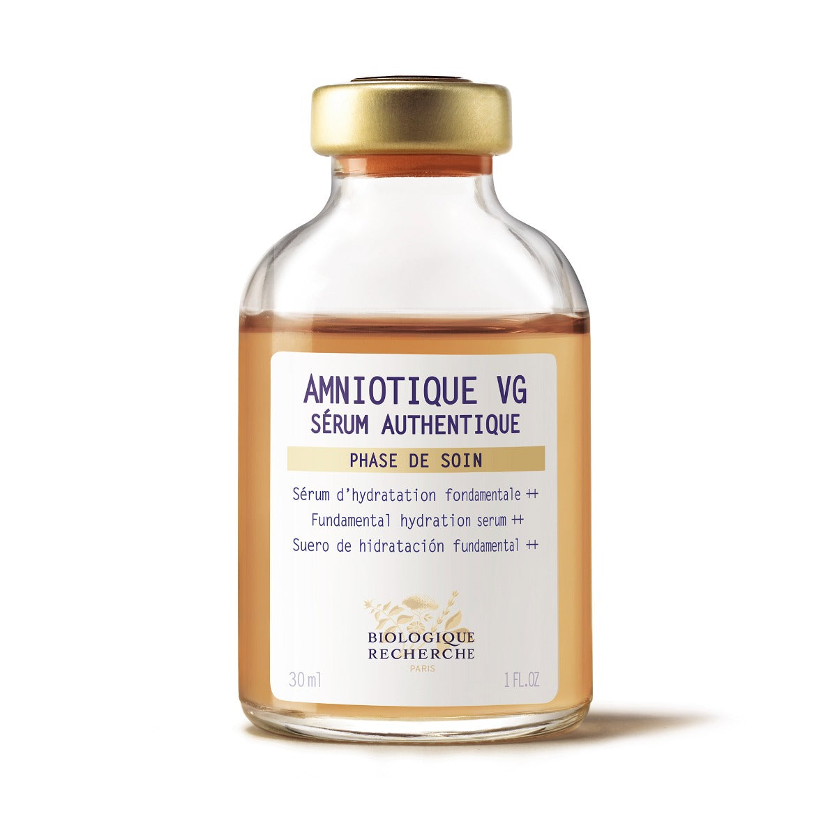 1.0 fl. oz. glass bottle of Biologique Recherche Amniotique VG Sérum Authentique with a gold cap and a white label featuring blue lettering, displayed on a white background. A hydrating and soothing facial serum formulated to replenish moisture, improve elasticity, and relieve tight, dehydrated skin.