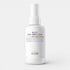 White bottle of Huile Sous-Ombilicale on a white background. Spray bottle of toning oil designed to reduce stomach bloating and puffiness, enriched with essential oils like cedarwood and juniper, placed on a clean background.