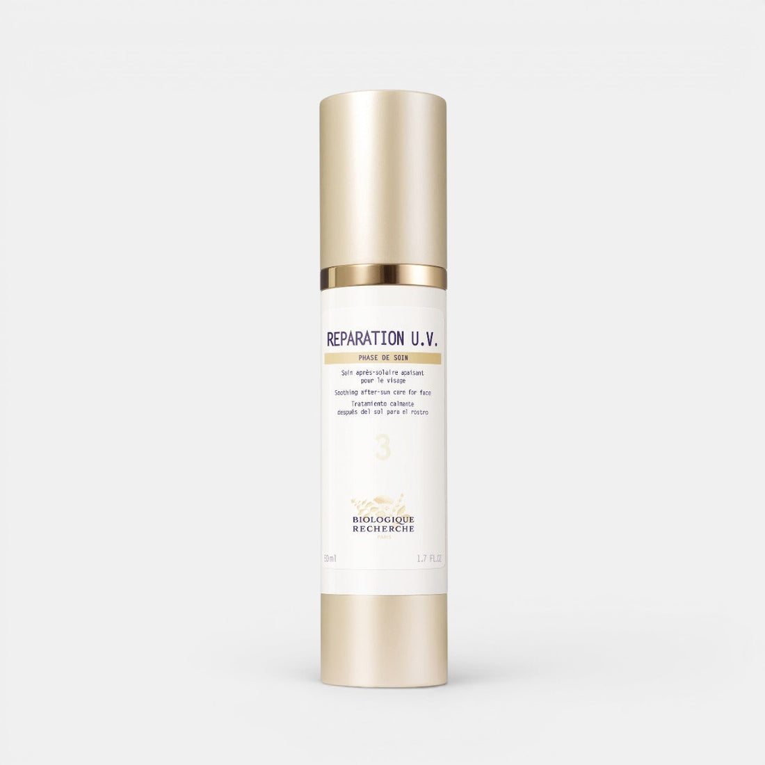 Biologique Recherche Réparation U.V. in a white and gold bottle with a gold pump cap, shown against a clean white background.