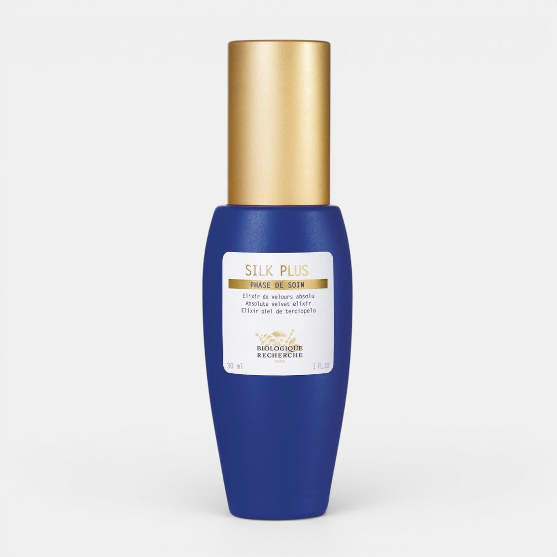 Blue Biologique Recherche Silk Plus bottle with gold cap on a white background. Mattifying &amp; Soothing Serum for Sensitive, Oily Skin.