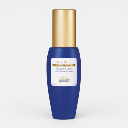 Blue Biologique Recherche Silk Plus bottle with gold cap on a white background. Mattifying &amp; Soothing Serum for Sensitive, Oily Skin.
