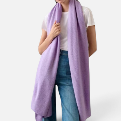 Shop Rescue Spa lavender cashmere travel wrap worn over a white t-shirt and blue jeans