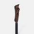 Texture photo of Revitalash length define mascara in dark brown. Tall upright applicator, light gray background.