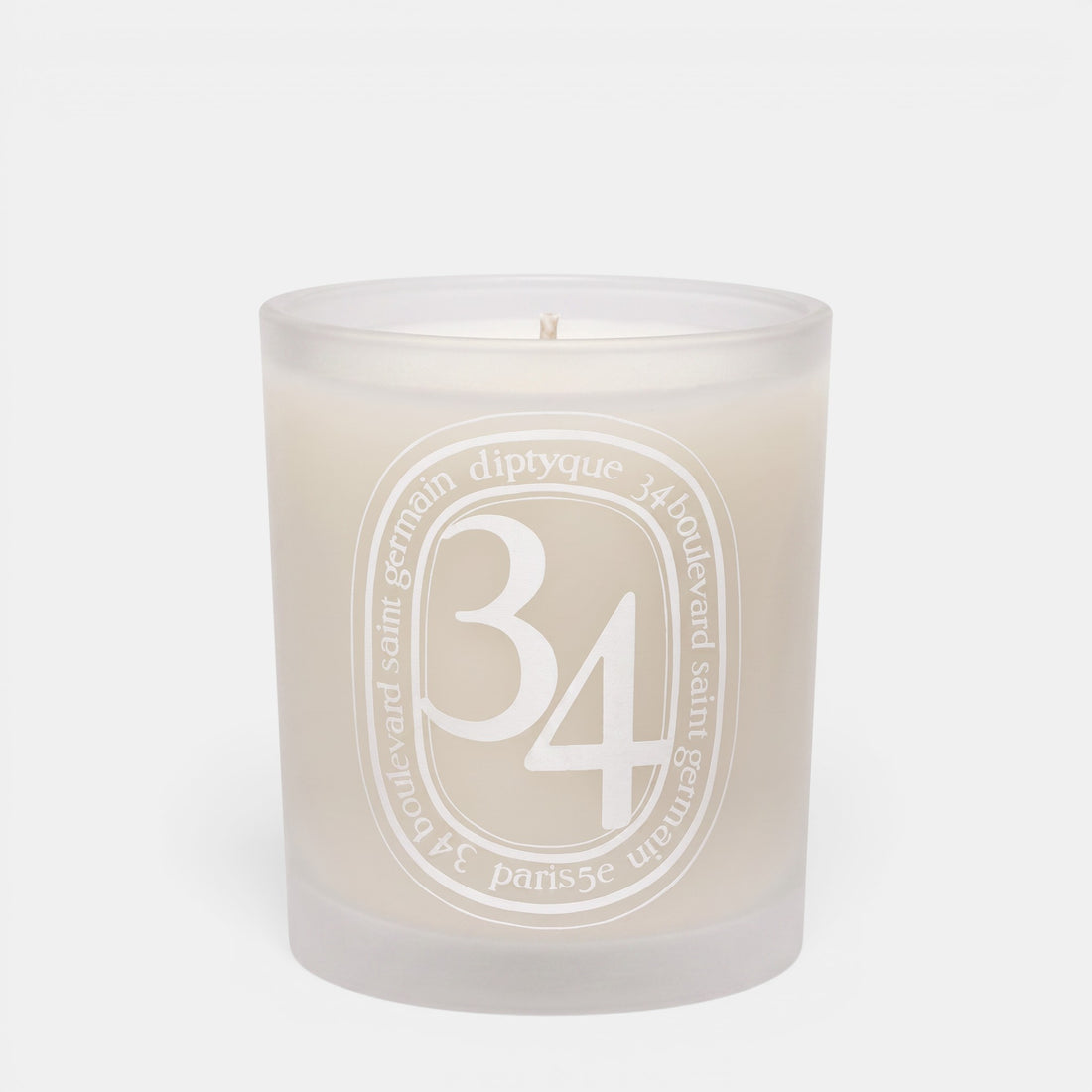 Shop Rescue Spa 34 Boulevard Saint Germain scented candle in a white opaline glass vessel with signature branding.