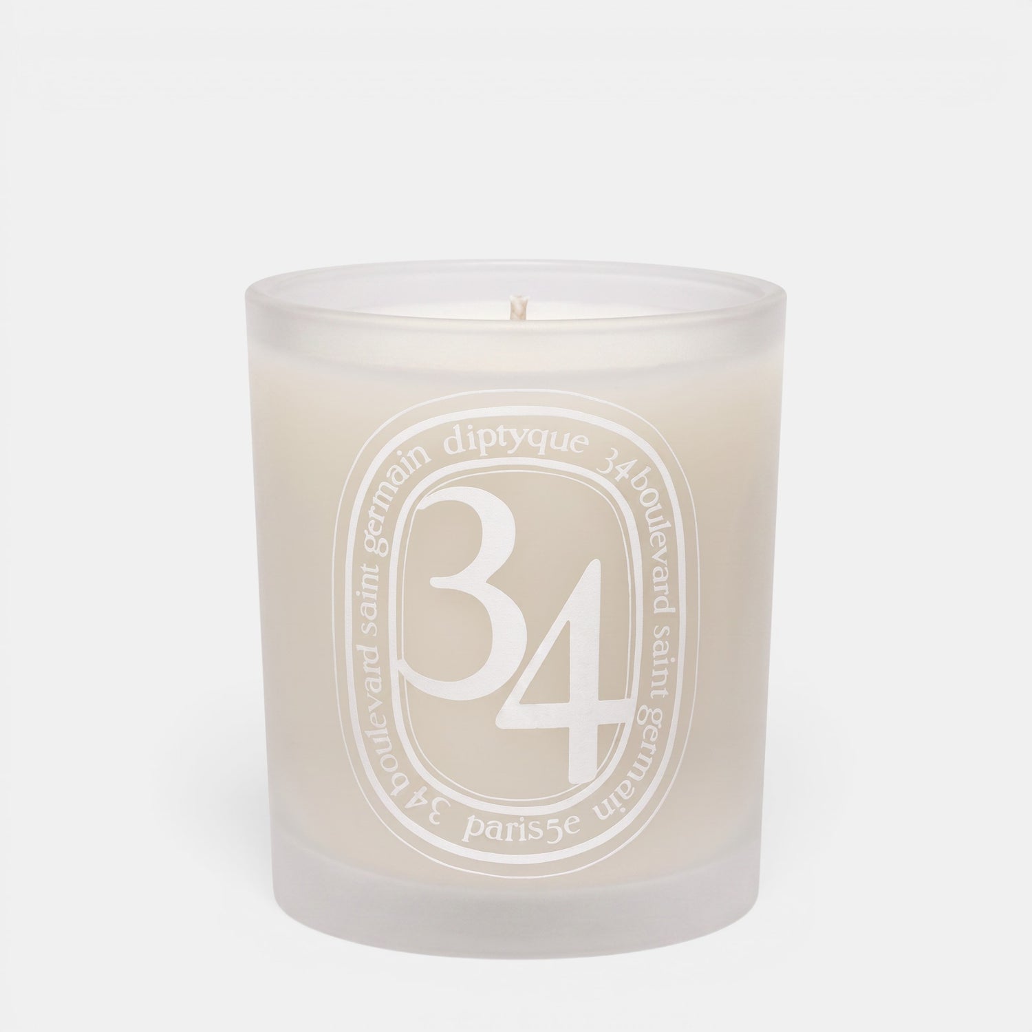 Shop Rescue Spa 34 Boulevard Saint Germain scented candle in a white opaline glass vessel with signature branding.