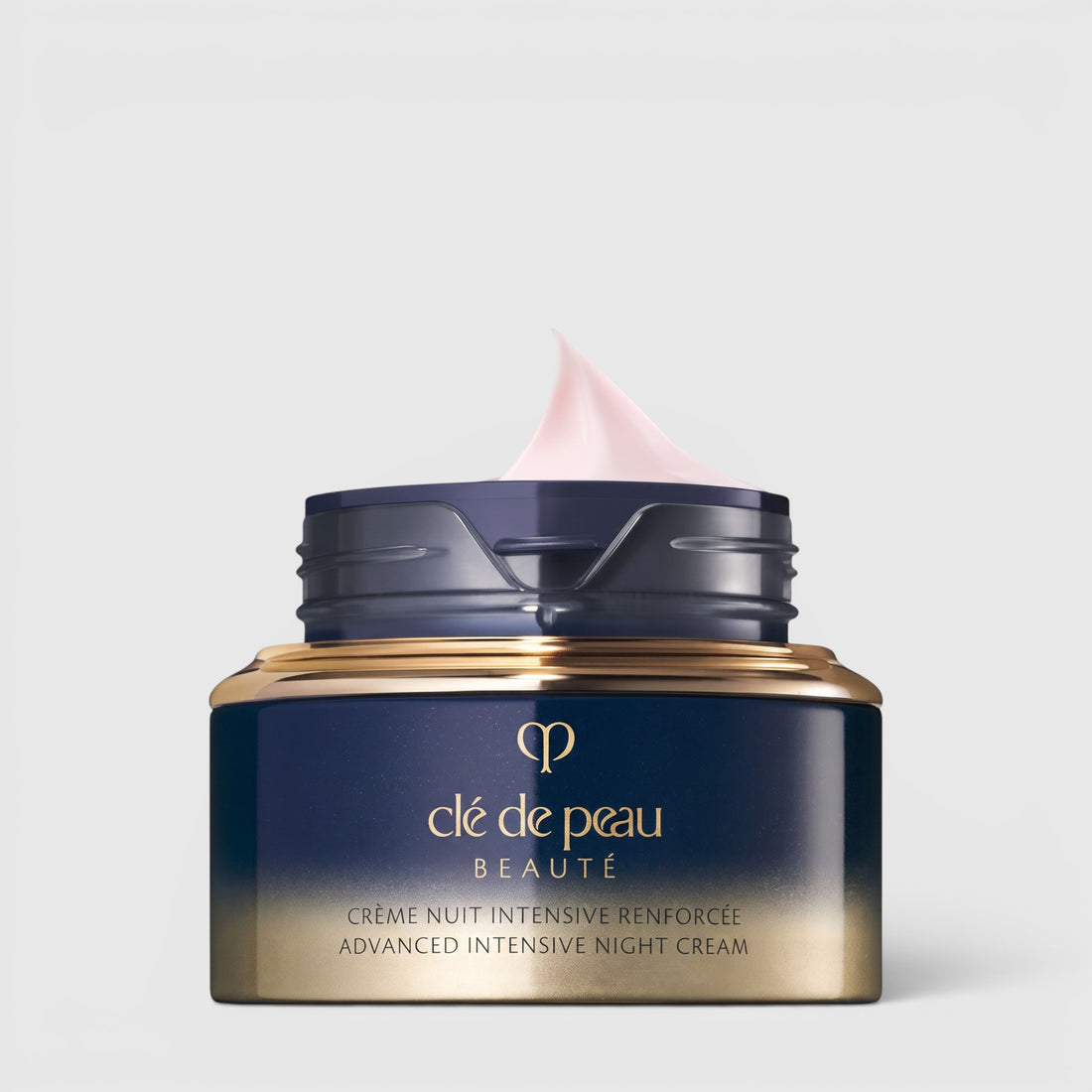 Shop Rescue Spa Advanced Intensive Night Cream in a navy and gold jar with a soft pink cream swirl on top