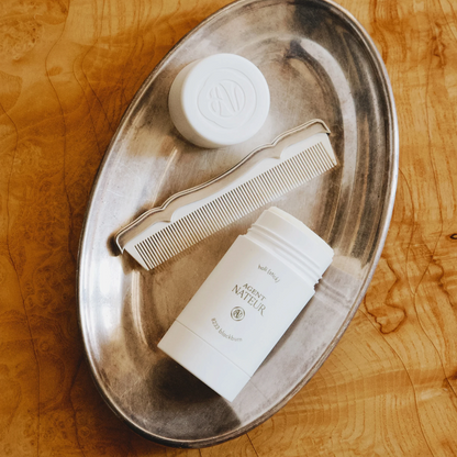 Shop Rescue Spa Agent Nateur holi (stick) 8233 Blackburn natural deodorant on a silver tray with a matching comb.