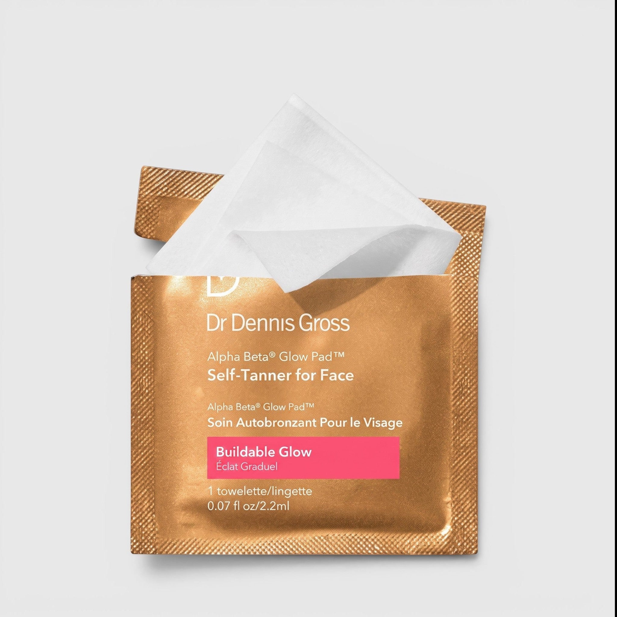 Shop Rescue Spa Dr. Dennis Gross Alpha Beta Glow Pad single-use facial self-tanning towelette in gold foil packaging.