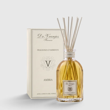 Shop Rescue Spa Ambra room diffuser with glass bottle, amber fragrance oil, and reed sticks next to a gift box.
