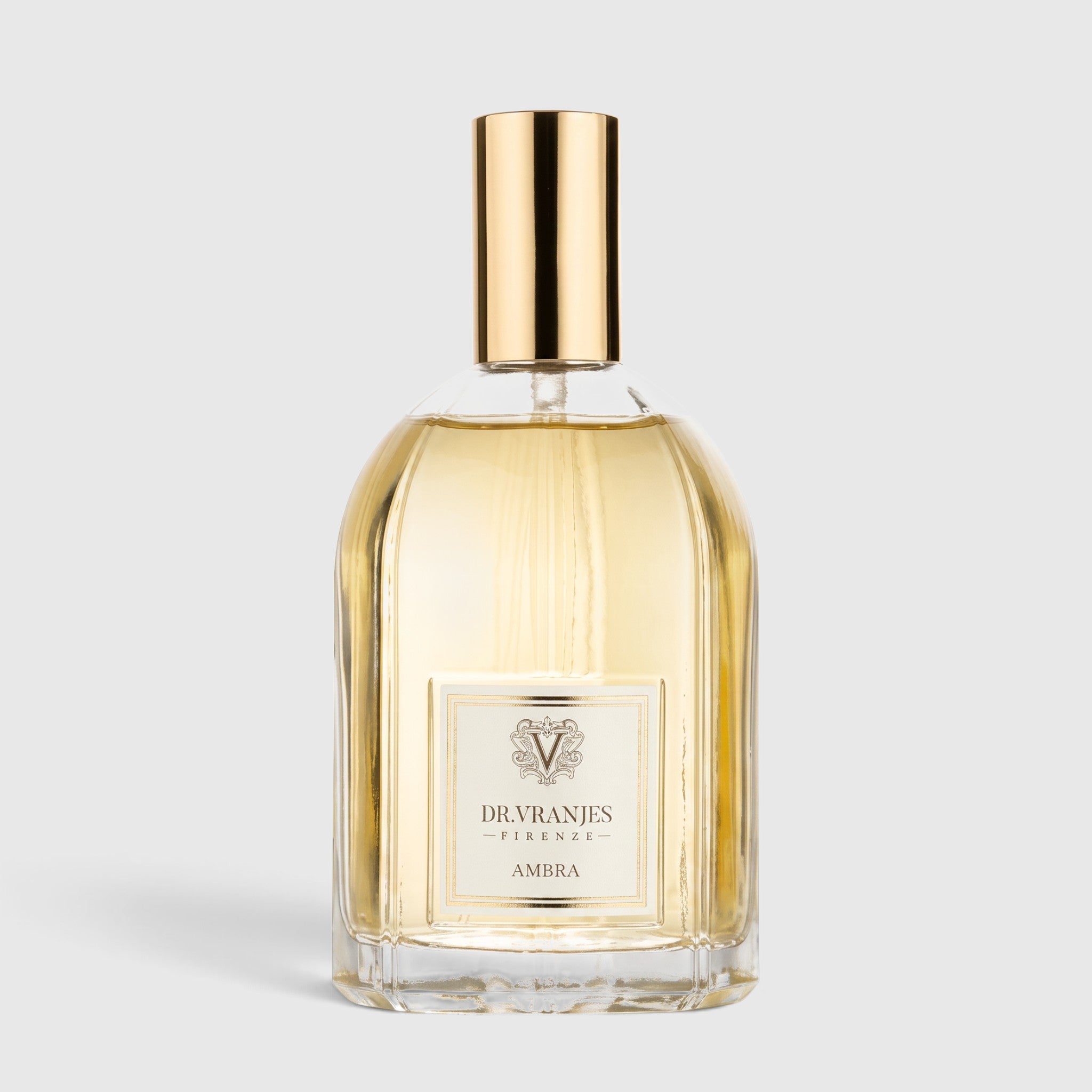Shop Rescue Spa Ambra room spray in a clear glass bottle with a gold cap, featuring amber and sandalwood fragrance.