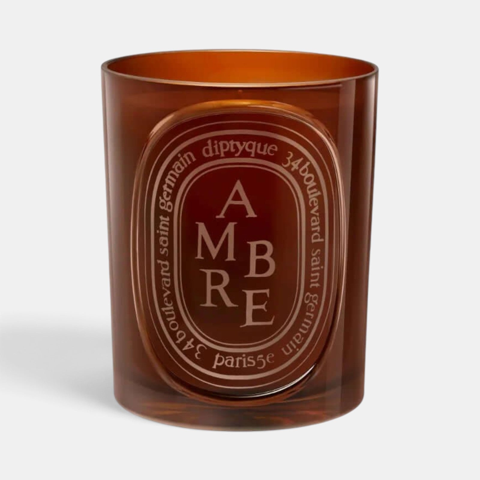 Shop Rescue Spa Diptyque Ambre scented candle in a translucent amber glass vessel with signature oval label